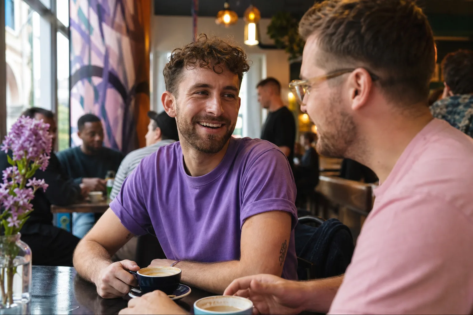 Two men chatting over coffee in Glasgow city centre
