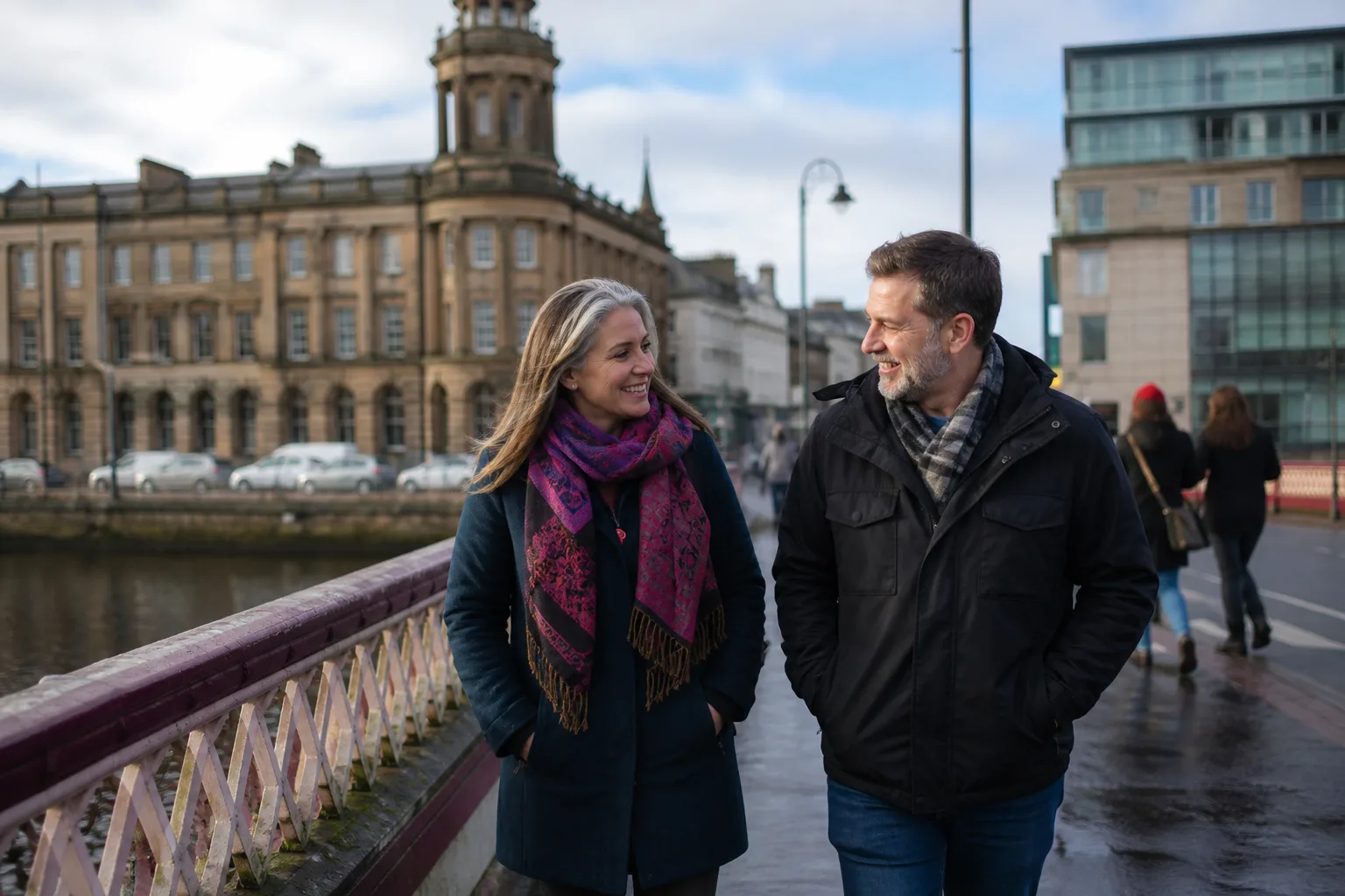 Two people over 40 chatting over coffee in Glasgow